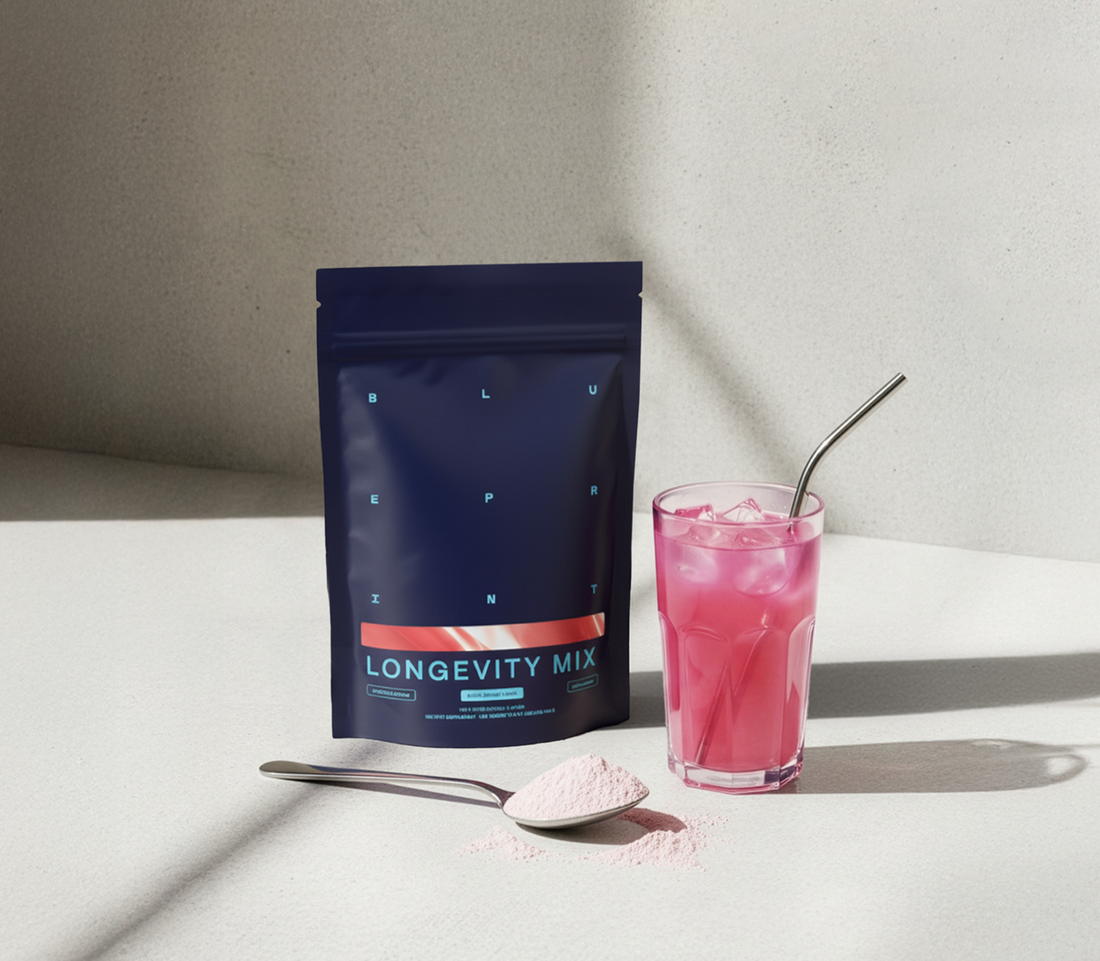 Longevity mix paired with the supplement powder in a spoon and the cold mixed drink